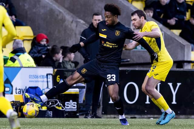 Livingston's Caleb Chukwuemeka holds off Ross County's Connor Randall during the Scottish Cup fourth round clash