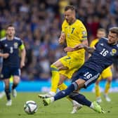 Scotland's Liam Cooper challenges Ukraine's Andriy Yarmolenko at Hampden on Wednesday. (Photo by Ross MacDonald / SNS Group)