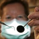 The SNP has been urged to ensure that “lifesaving” dental checks are available to all Scots