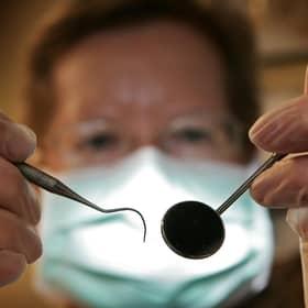 The SNP has been urged to ensure that “lifesaving” dental checks are available to all Scots