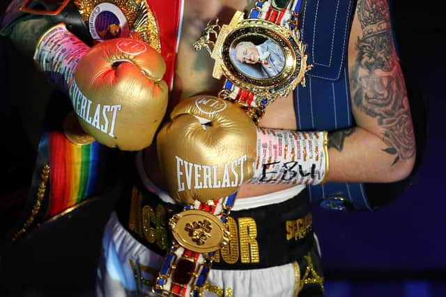 Lee McGregor celebrates with his belts after victory over Karim Guerfi of France. Picture: Alex Livesey/Getty Images