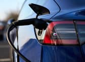 A Tesla electric vehicle being charged in Hayes, west London. Picture date: Tuesday March 8, 2022.