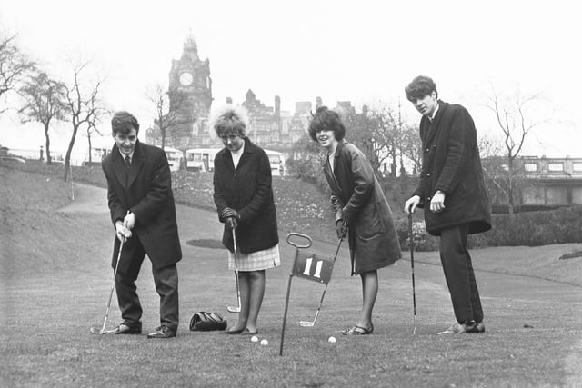 Princes Street Gardens used to be home to a popular putting green. Teenagers are pictured testing their golfing skills there in April 1966.