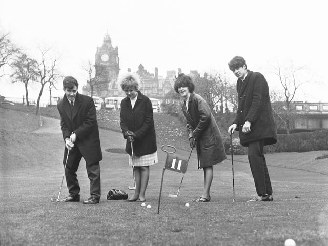 Princes Street Gardens used to be home to a popular putting green. Teenagers are pictured testing their golfing skills there in April 1966.
