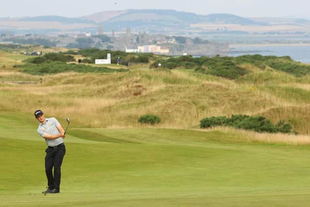 St Andrews provides a spectacular backdrop as David Law plays the 18th hole during the first round of the Hero Open at Fairmont St Andrews. Picture: Andrew Redington/Getty Images.