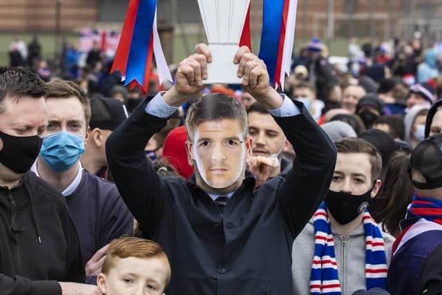 A Rangers fan with a Steven Gerrard mask and cardboard trophy ahead of Scottish Premiership match between Rangers and St Mirren at Ibrox Stadium, on March 06, 2021, in Glasgow, Scotland. (Photo by Craig Williamson / SNS Group)
