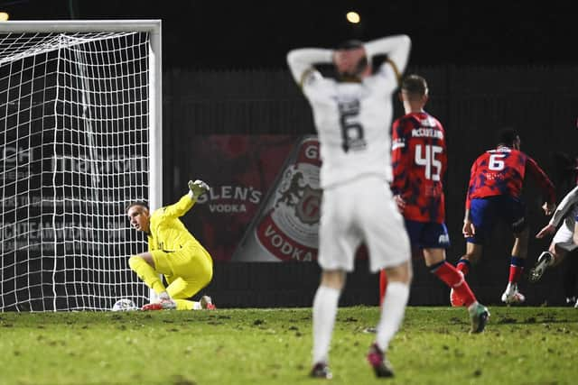 Robby McCrorie makes a save to deny Michael Ruth during Rangers' 4-1 win over Dumbarton.