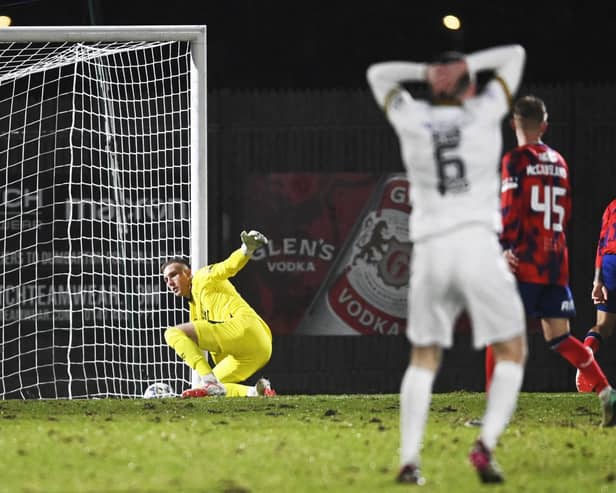 Robby McCrorie makes a save to deny Michael Ruth during Rangers' 4-1 win over Dumbarton.