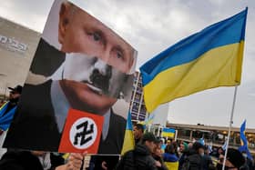 Vladimir Putin has been compared to Adolf Hitler by protesters all over the world, including these people in Tel Aviv, Israel, in March (Picture: Jack Guez/AFP via Getty Images)