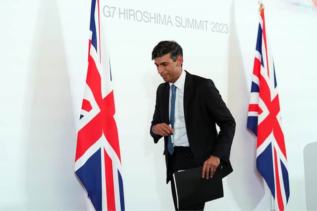 Prime Minister Rishi Sunak leaves after a press conference at the International Conference Centre during the G7 Summit