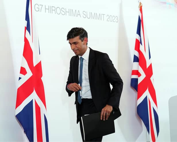 Prime Minister Rishi Sunak leaves after a press conference at the International Conference Centre during the G7 Summit