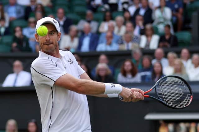 Andy Murray returns the ball at Wimbledon 2022 (Photo by ADRIAN DENNIS/AFP via Getty Images)