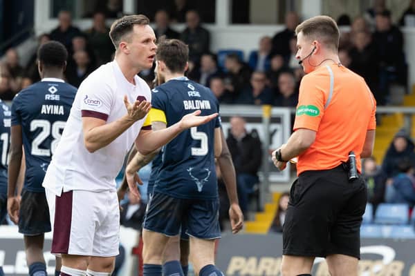 Hearts' Lawrence Shankland was booked for simulation against Ross County.
