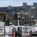 A "poor performance" in living standards has resulted in disposable income falling in Scotland's major cities