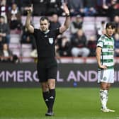 Celtic's Yang Hyun-jun watches referee Don Robertson signal he is going to the VAR monitor. The South Korean winger was subsequently sent off.
