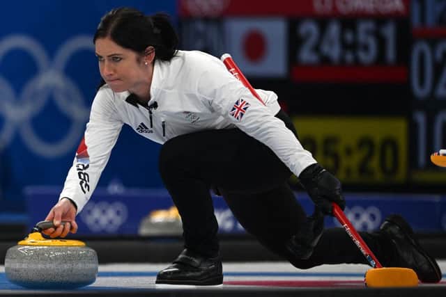 Britain's Eve Muirhead curls the stone during the women's round robin session 12 game of the Beijing 2022 Winter Olympic Games curling competition between players of Russia's Olympic Committee and Britain. (Photo by LILLIAN SUWANRUMPHA/AFP via Getty Images)