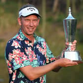Marcel Siem poses with the trophy after winning the Hero Indian Open at DLF Golf and Country Club. Picture: Sajjad Hussaian/AFP via Getty Images.