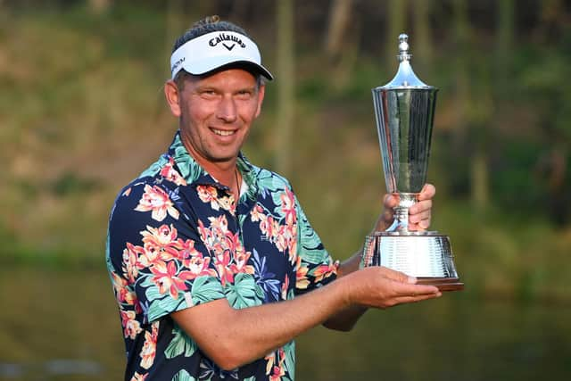 Marcel Siem poses with the trophy after winning the Hero Indian Open at DLF Golf and Country Club. Picture: Sajjad Hussaian/AFP via Getty Images.