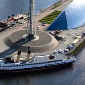 Queen Mary beside the Glasgow Science Centre tower this week with Waverley behind. Picture: John Devlin