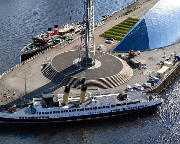 Queen Mary beside the Glasgow Science Centre tower this week with Waverley behind. Picture: John Devlin