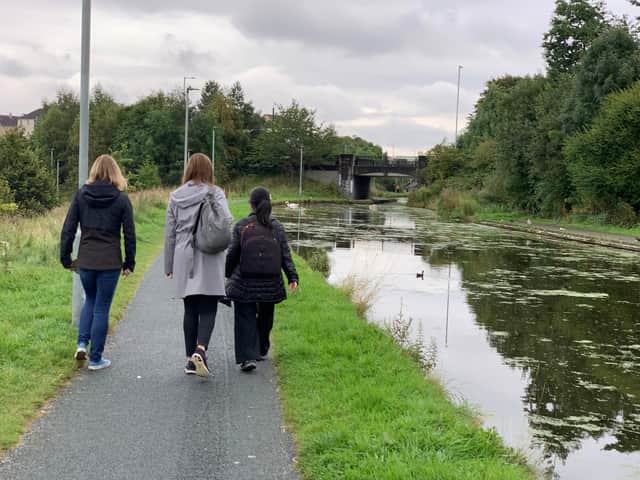 People walking along canal at Wester Hailes in Edinburgh