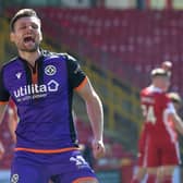 Ryan Edwards celebrates after scoring against Aberdeen in Dundee United's 3-0 victory at Pittodrie. Picture: SNS