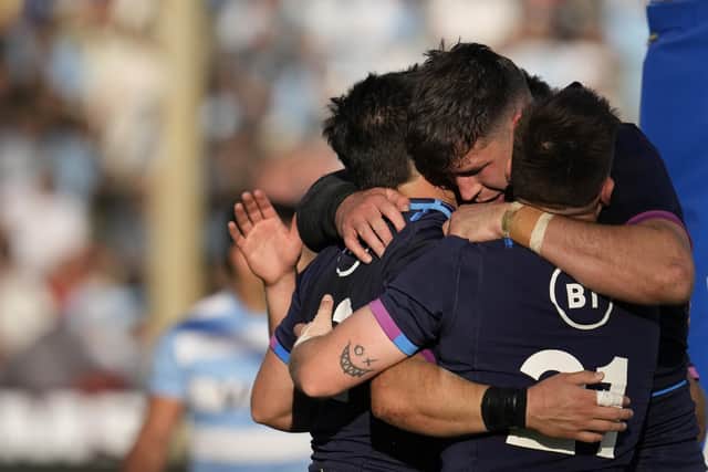 Scotland's Sam Johnson, left, celebrates with teammates after marking a try against Argentina's Los Pumas during their rugby test match in Salta, Argentina, Saturday, July 9, 2022. (AP Photo/Natacha Pisarenko)