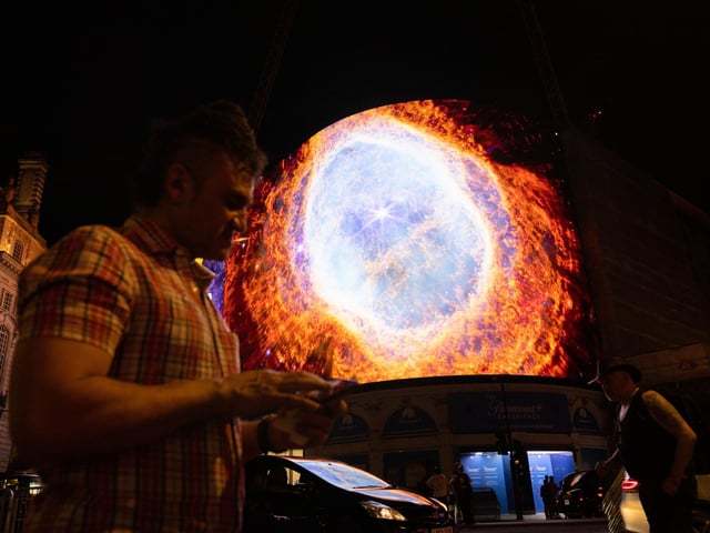 Nasa broadcasts the first images from the James Webb Space Telescope, the world's most advanced space telescope, on the Piccadilly Lights screen in London.