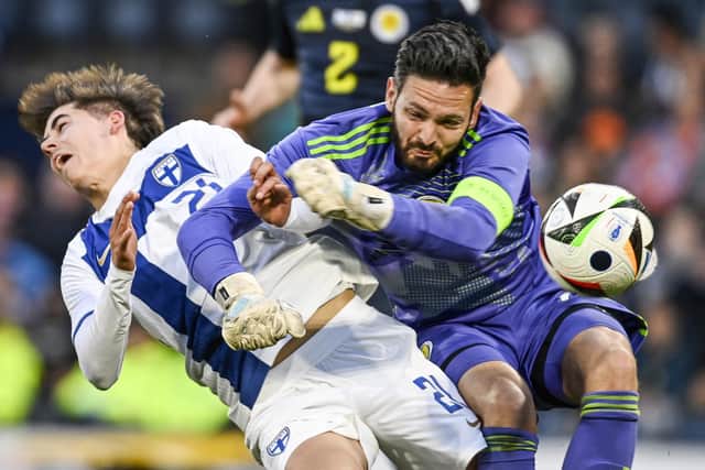 Scotland's Craig Gordon was penalised for this foul on Tomas Galvez, leading to Finland's equaliser from the penalty spot at Hampden.