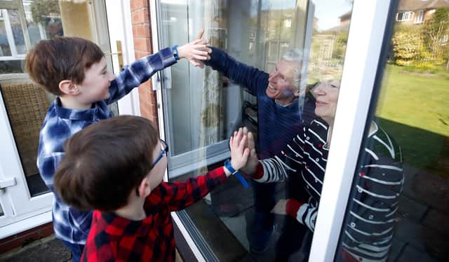 For many, this is the closest they have been able to get to loved ones during the lockdown. Photo: Martin Rickett/PA Wire