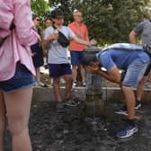 A man refreshes at a fountain in Rome. The Italian capital is top of the red alert list as one of the hottest cities in the country.