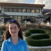 Grace Crawford stands in front of the Albany clubhouse during the final round of the Hero World Challenge on Sunday.