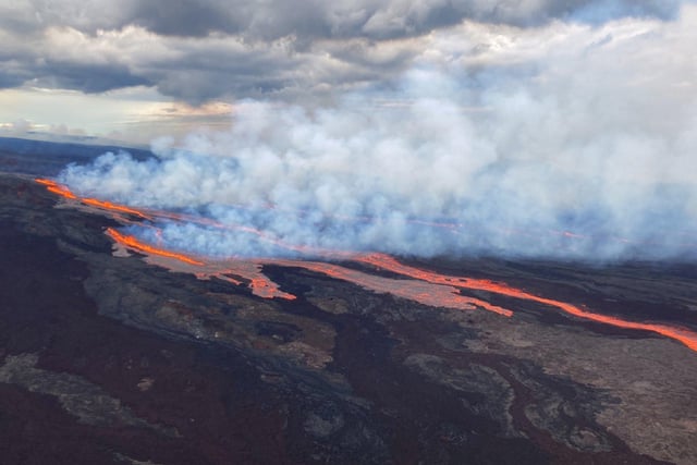 In this aerial photo released by the U.S. Geological Survey, the Mauna Loa volcano is seen erupting from vents on the Northeast Rift Zone on the Big Island of Hawaii.  (U.S. Geological Survey via AP)