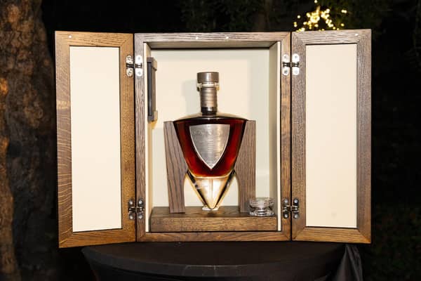 The handmade crystal decanter is designed around the shape of a dirk. The oak cabinet it is housed in is handcrafted in south-west Scotland by Fairlie Furniture. Picture: Christy Linder