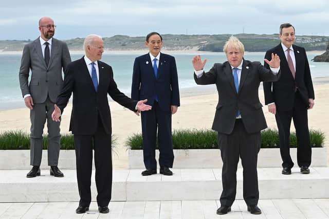 US President Joe Biden and Boris Johnson pose for pictures with other world leaders during G7 Summit In Carbis Bay, in June (Picture: Leon Neal/WPA pool/Getty Images)