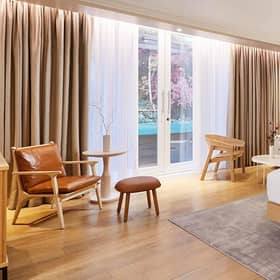 The calming neutral hues of a studio bedroom at The Prince Akatoki hotel, London.
