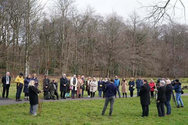 People taking part in a minute's silence at Scotland's Covid Memorial in Glasgow to mark third anniversary of Covid-19 pandemic as part of the National Day of Reflection. Picture date: Thursday March 23, 2023.