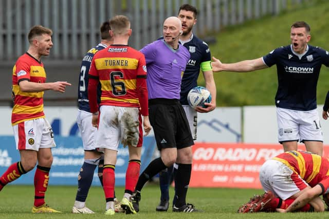 A free kick is given for a challenge on Partick's Brian Graham during a cinch Championship match between Partick Thistle and Dundee at Firhill.