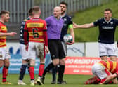 A free kick is given for a challenge on Partick's Brian Graham during a cinch Championship match between Partick Thistle and Dundee at Firhill.