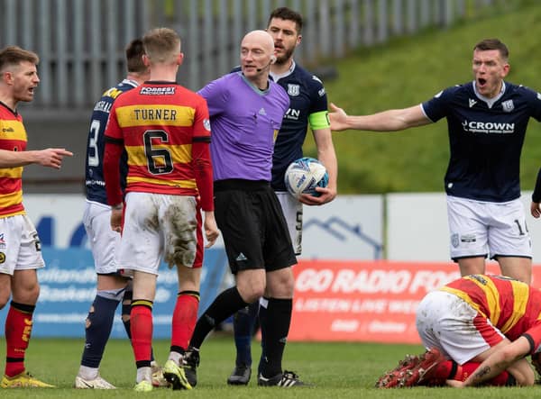 A free kick is given for a challenge on Partick's Brian Graham during a cinch Championship match between Partick Thistle and Dundee at Firhill.