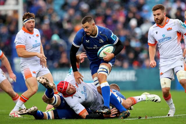 Leinster's Max Deegan and Grant Gilchrist of Edinburgh clash during the URC match.