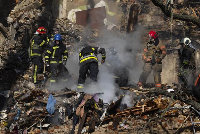 Firefighters appear on the scene to put out a fire in a four-story residential building after a 'kamikaze drone' attack in Kyiv. Picture: Paula Bronstein/Getty Images