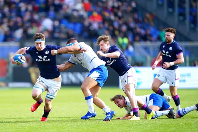 Scotland's Rory Darge is tackled by Italy's Danilo Fischetti during the match in Rome. Picture: Mike Egerton/PA Wire.