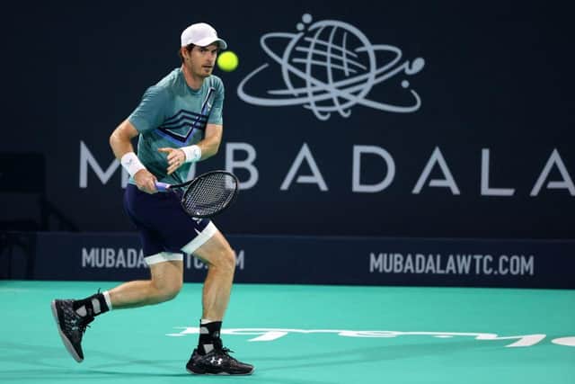 Britain's Andy Murray returns the ball to Britain's Dan Evans during their quarter-final match in the Mubadala World Tennis Championship in the Gulf emirate of Abu Dhabi on December 16, 2021. (Photo by GIUSEPPE CACACE/AFP via Getty Images)