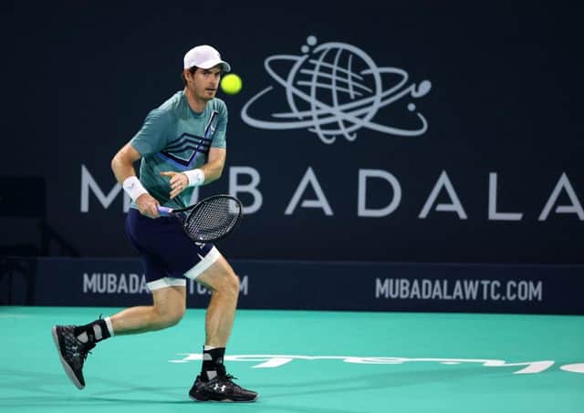 Britain's Andy Murray returns the ball to Britain's Dan Evans during their quarter-final match in the Mubadala World Tennis Championship in the Gulf emirate of Abu Dhabi on December 16, 2021. (Photo by GIUSEPPE CACACE/AFP via Getty Images)