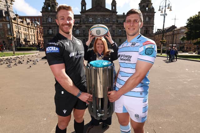 Kyle Steyn, Lord Provost of the City of Glasgow Jacqueline McLaren, and Rory Darge alongside the United Rugby Championship trophy during a Glasgow Warriors civic reception at the Glasgow City Chambers, on September 04, 2024. (Photo by Ross MacDonald / SNS Group)