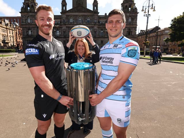 Kyle Steyn, Lord Provost of the City of Glasgow Jacqueline McLaren, and Rory Darge alongside the United Rugby Championship trophy during a Glasgow Warriors civic reception at the Glasgow City Chambers, on September 04, 2024. (Photo by Ross MacDonald / SNS Group)