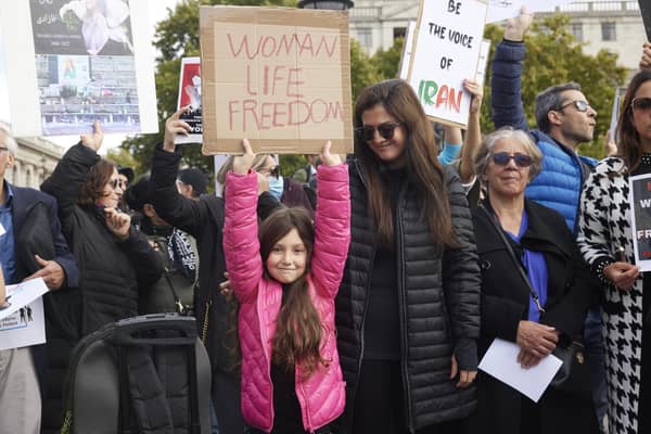 People gather in solidarity with those protesting in Iran, following the death of Mahsa Amini, 22, after she was arrested for not wearing her hijab correctly (Picture: Alex McBride/Getty Images)