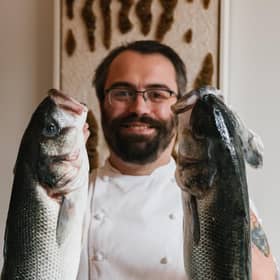 Dan Ashmore of Askr with his fishy friends. Copyright - Grant Anderson / www.grantanderson.me / @grantandersondotme
