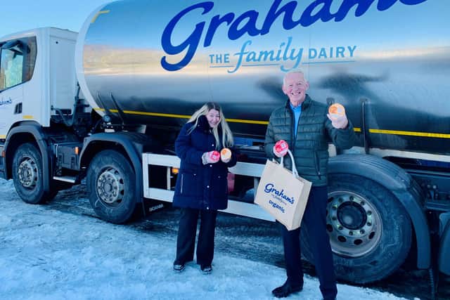 Dr Robert Graham Senior, Chairman Graham’s The Family Dairy and Charlene Leslie, the woman who pushed their lorry up the snowy hill.
